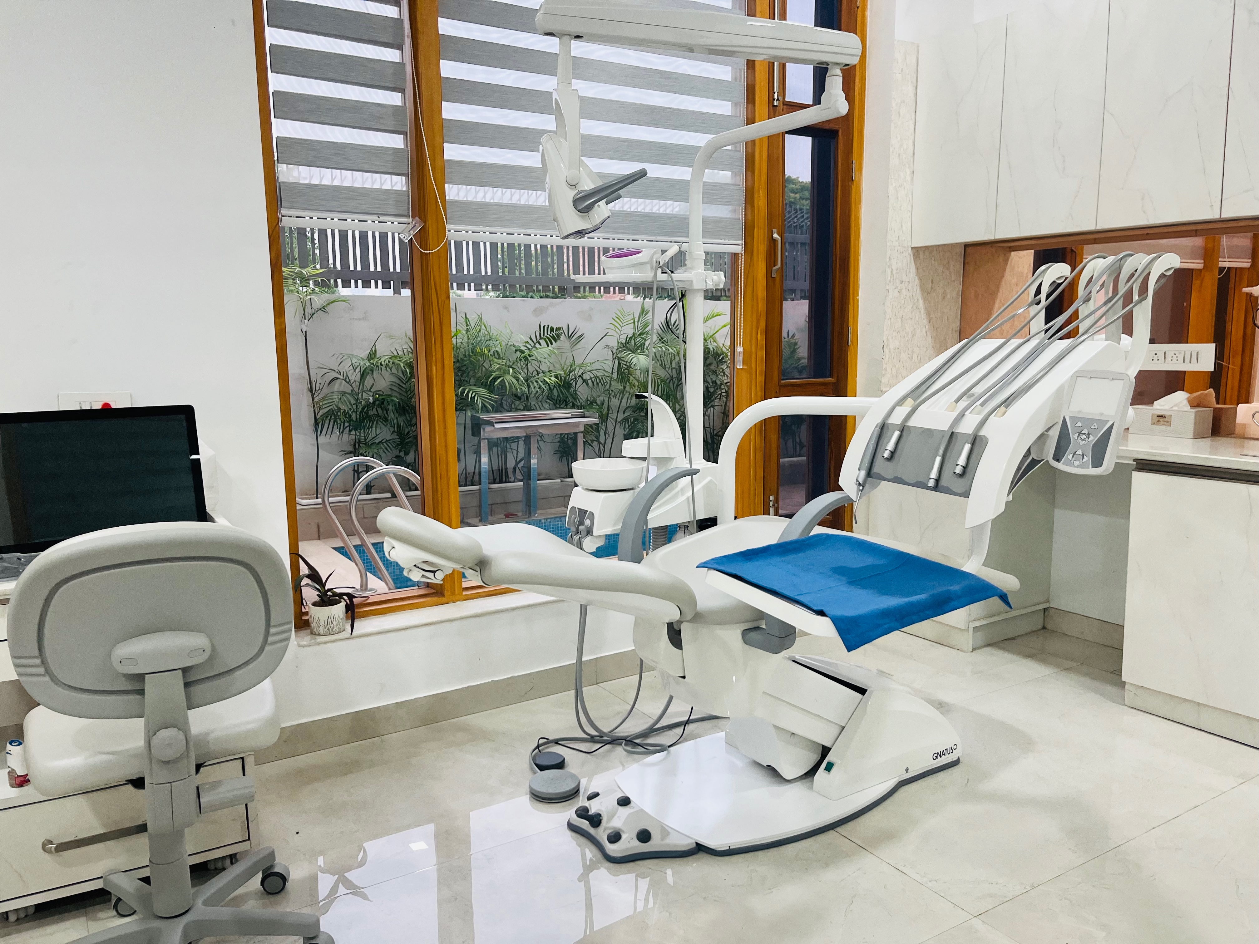 Dental Ville dentist consulting a patient in the treatment room