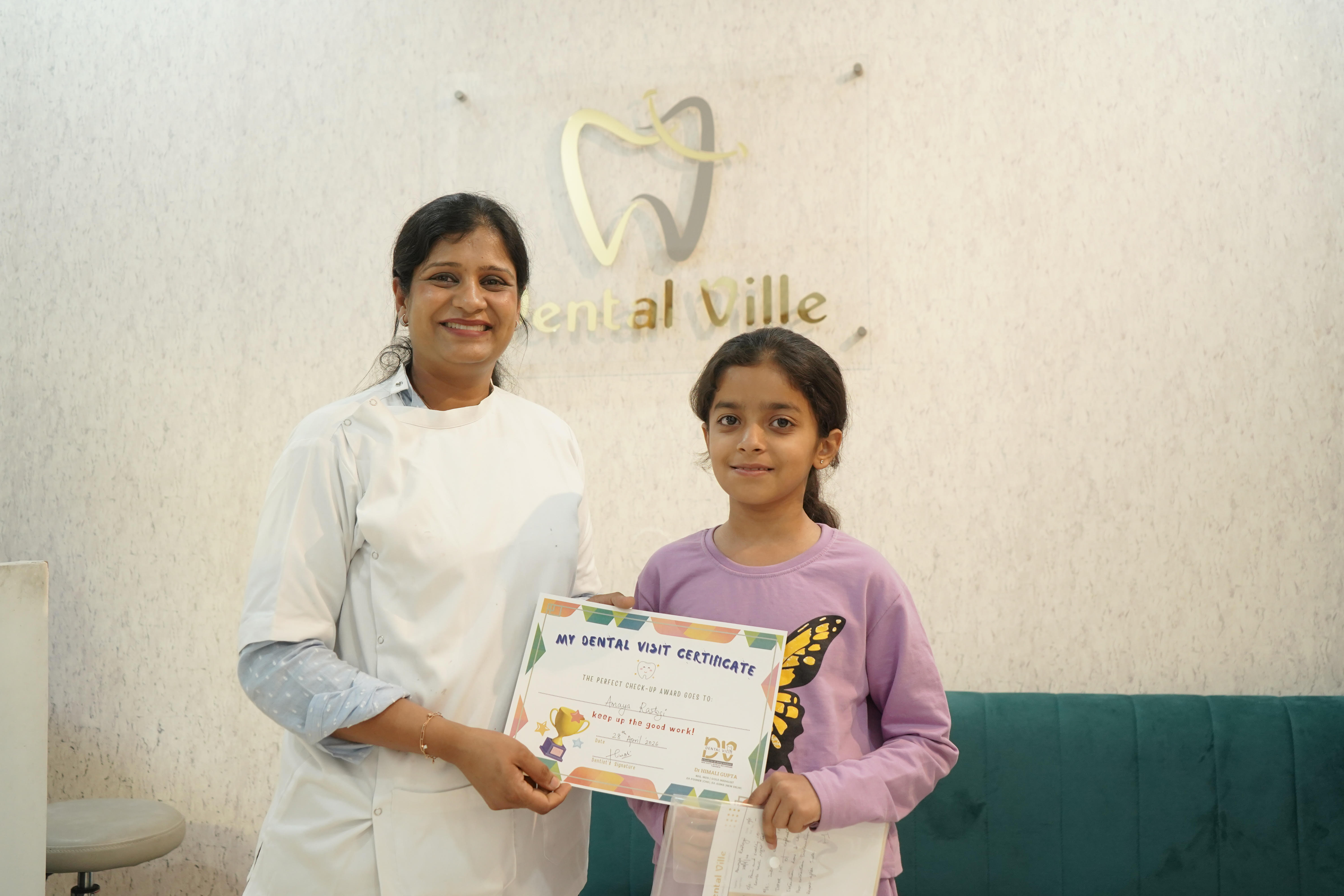 Happy young dental client holding a visit certificate at Dental Ville